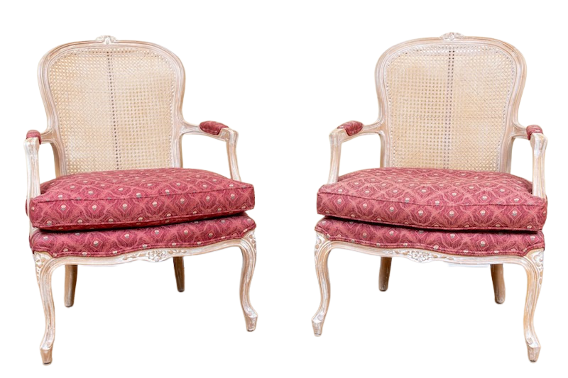 A pair of French Country style chairs upholstered in deep pink fabric